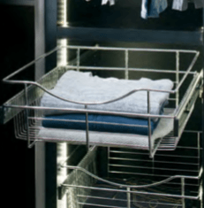 Wire basket shelves with folded clothes inside a closet.