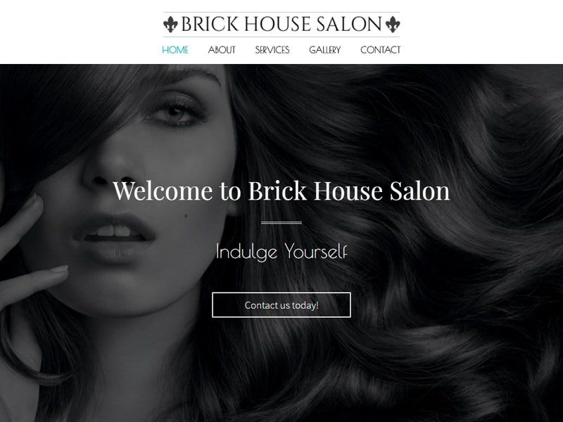 Woman with dark hair, salon website welcome screen.