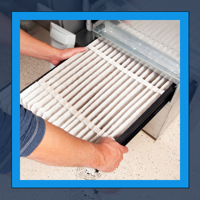 A person is taking out a filter from a machine