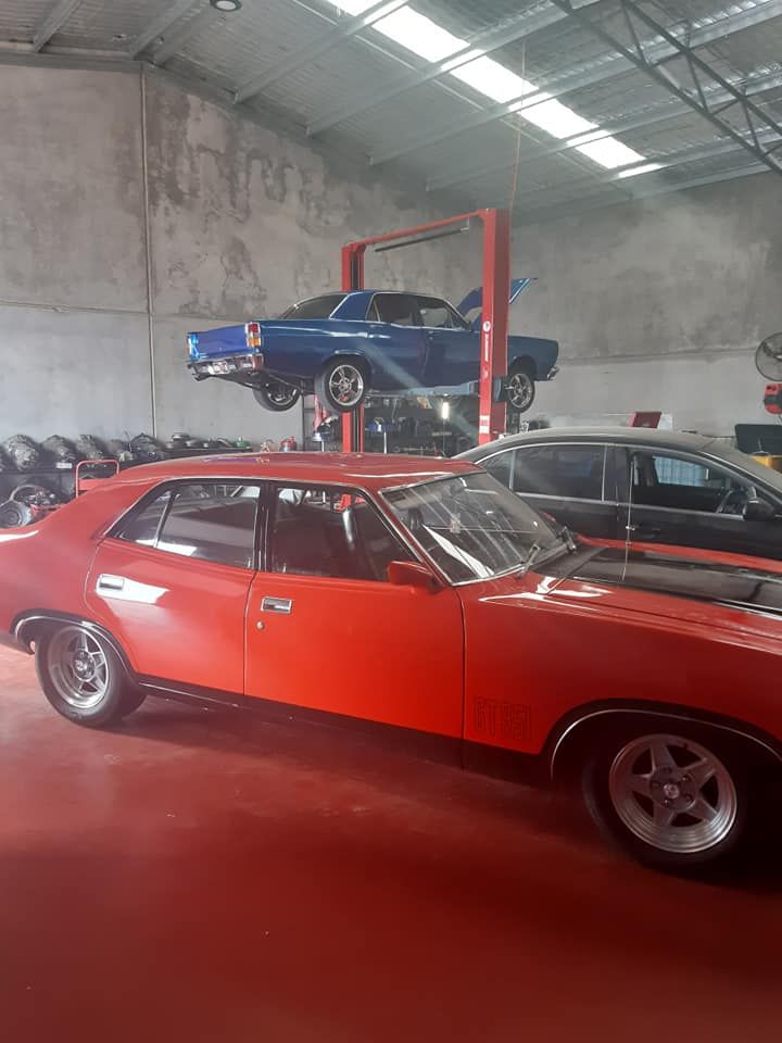A Red Car is in a Garage — Burko Transmissions in Wangaratta, VIC