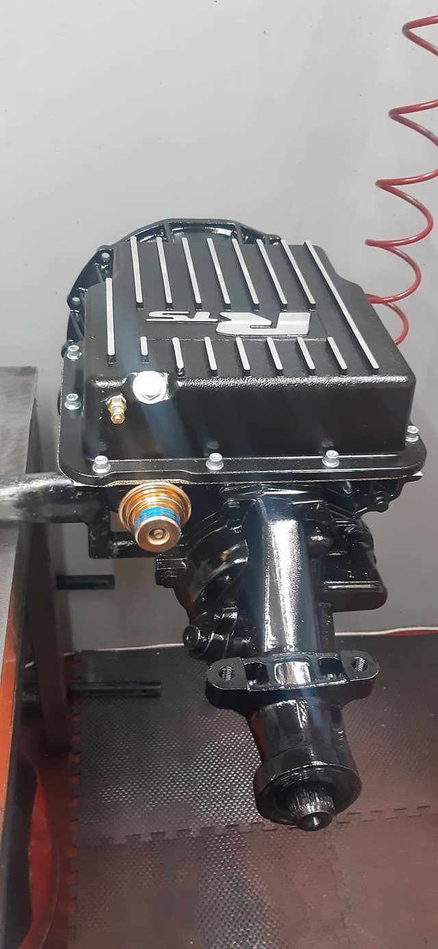 A Black Engine is Sitting on a Table Next to a Wall — Burko Transmissions in Benalla, VIC