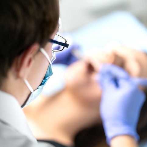 Dentist Performing A Tooth Extraction — Hollywood, SA — Norwood & Kensington Dental