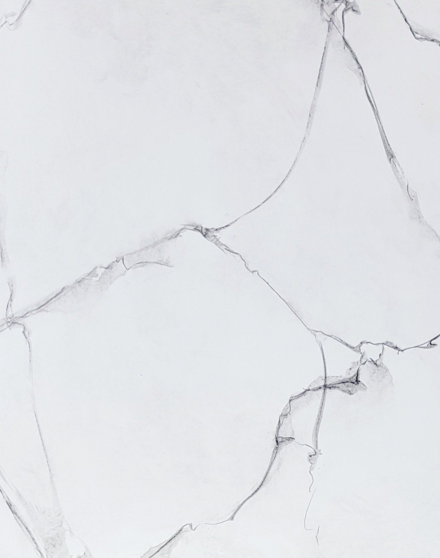 White marble surface with gray veining.
