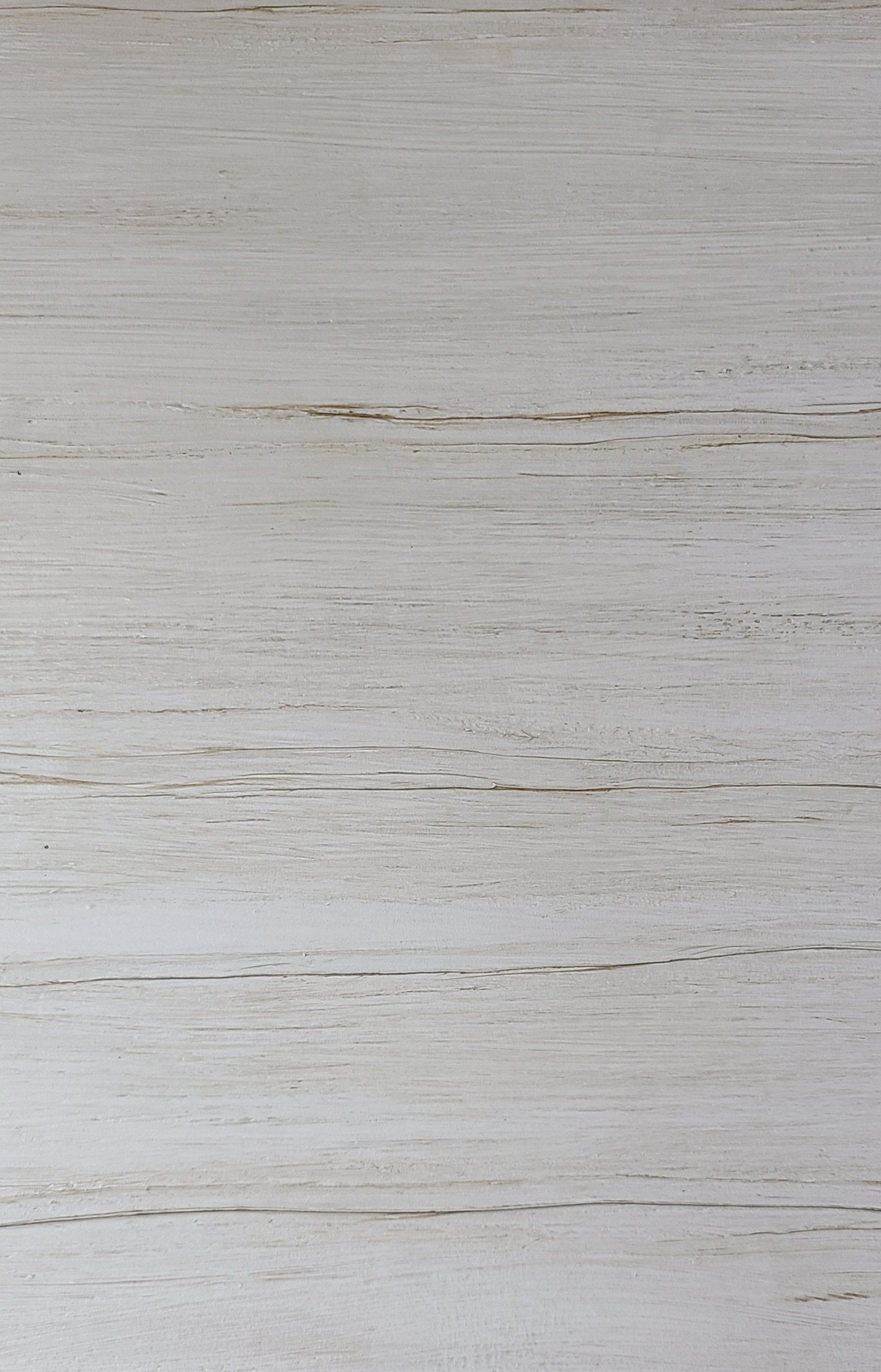 White wooden planks with visible horizontal grain lines.