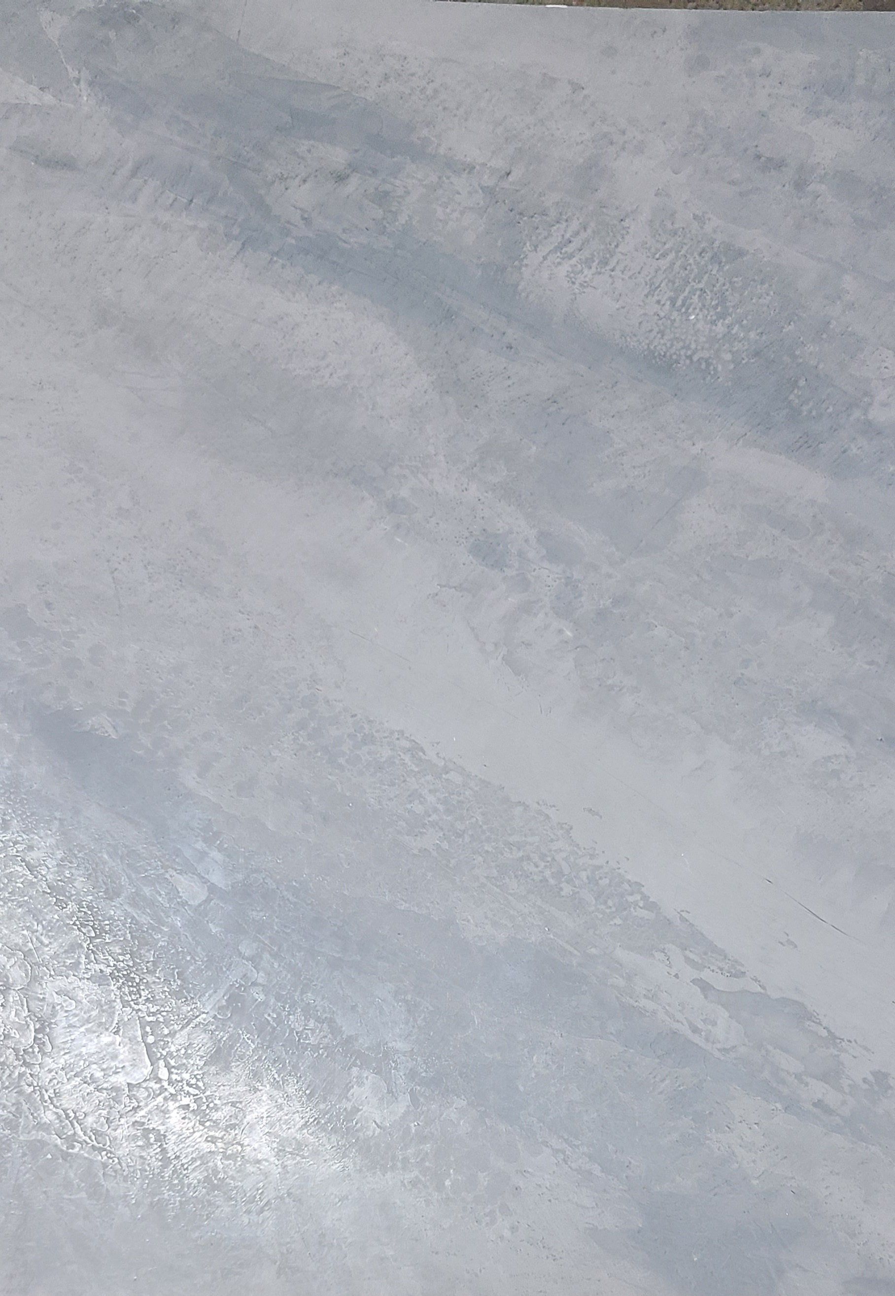 Abstract light blue and white painted surface.