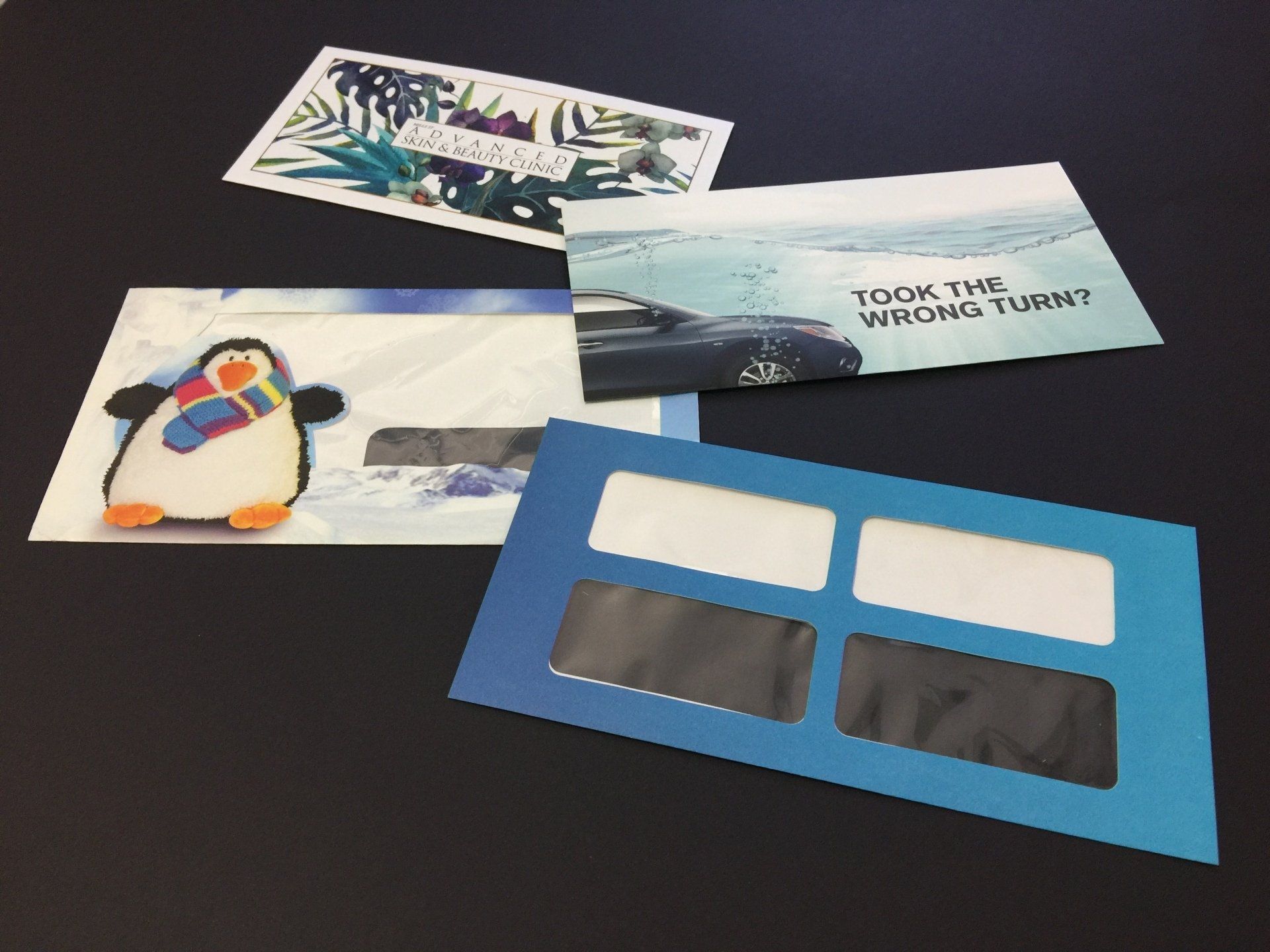 a blue envelope with a picture of a penguin on it