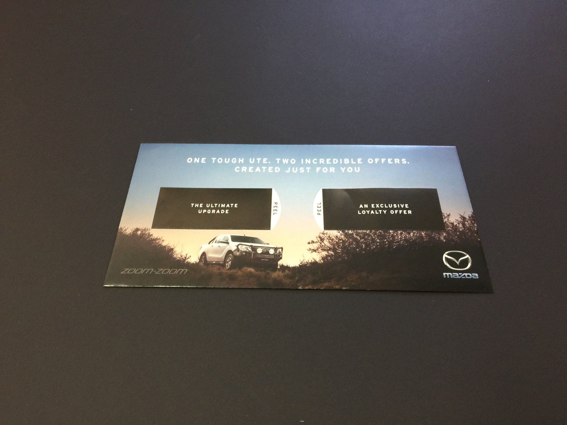 a mazda envelope with a picture of a car on it
