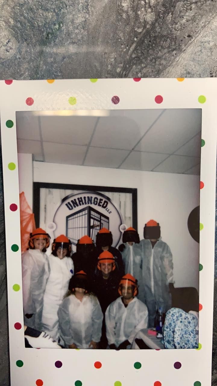 A group of people are posing for a picture in a room.