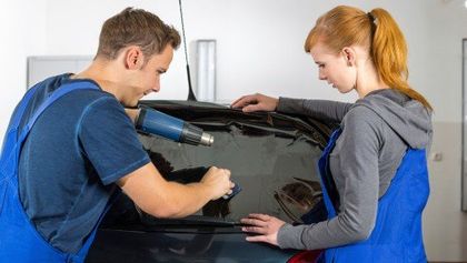 Mechanic tinting car window with tinted foil or film - Tinting in Lake Villa, IL