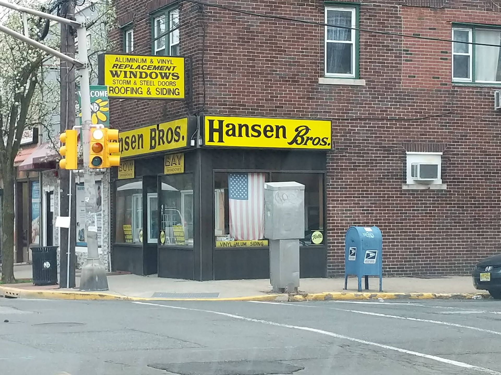 A store front with a yellow sign that says hansen bros