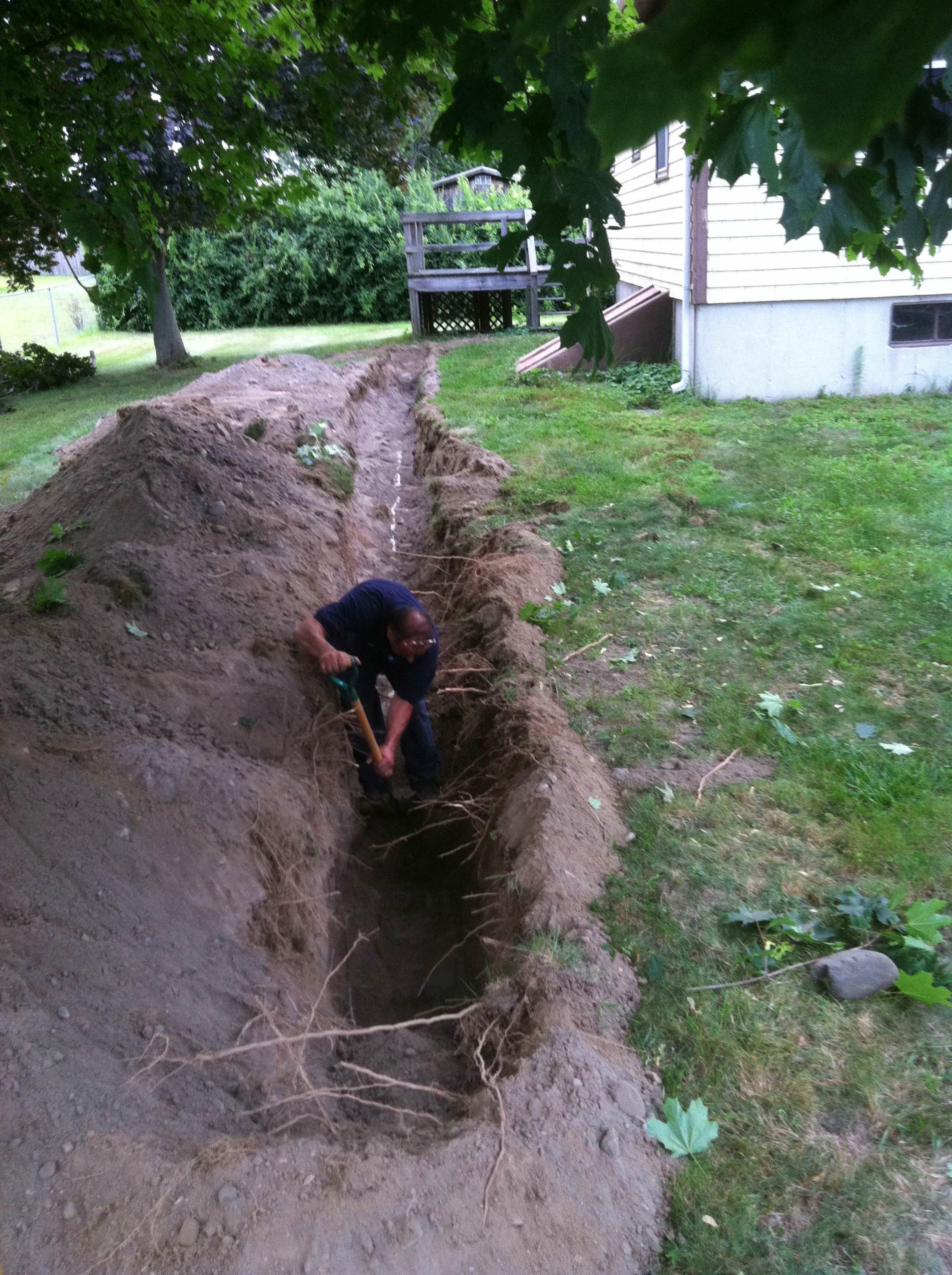Man Using Shovel — Portsmouth, RI — Ocean State Septic LLC