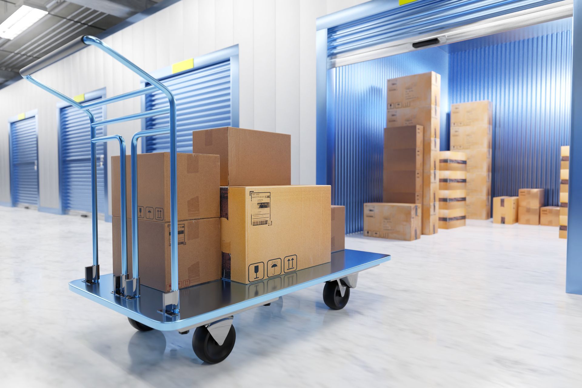 Boxes on a hand truck in a storage unit.  Blue and brown, indoors.