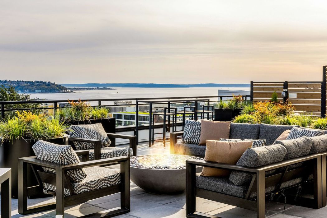 Rooftop deck with view of Seattle waterfront and firepit