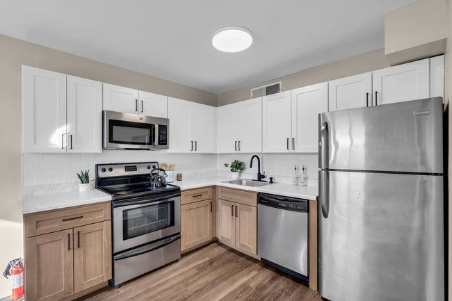 Modern kitchen with appliances at Town Bank Manor
