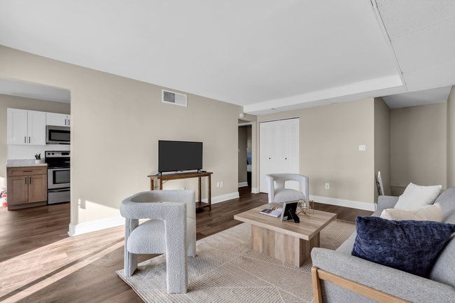 Bright living area with modern finishes at Town Bank Manor