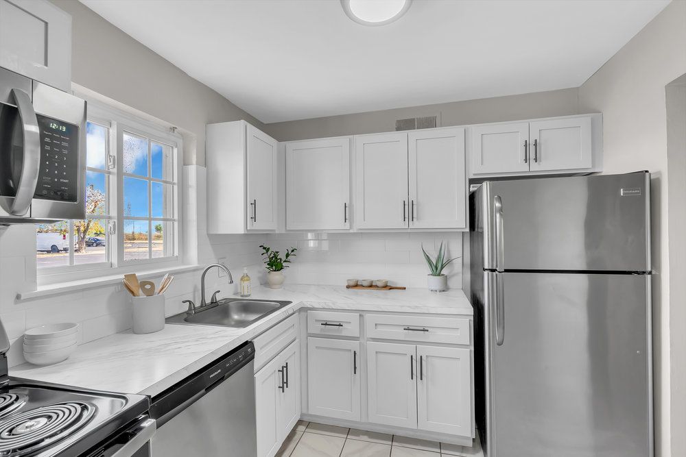 Modern kitchen with appliances at Town Bank Manor