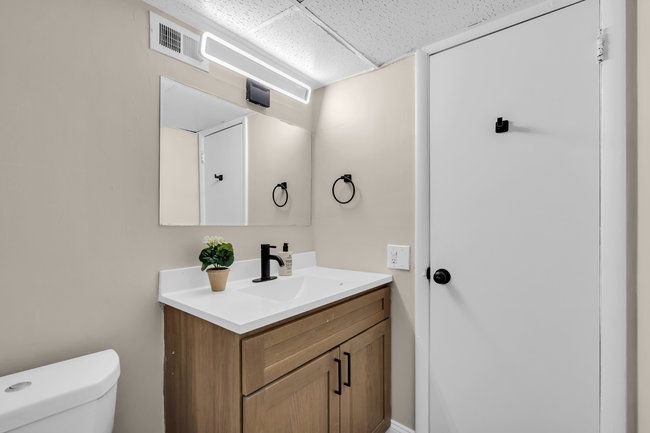 Bathroom with vanity and shower at Town Bank Manor