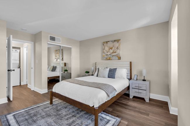 Spacious bedroom with modern flooring at Town Bank Manor