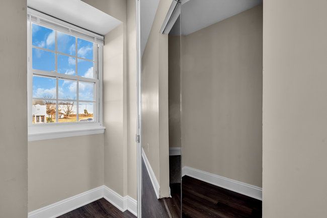 Interior hallway with natural light at Town Bank Manor