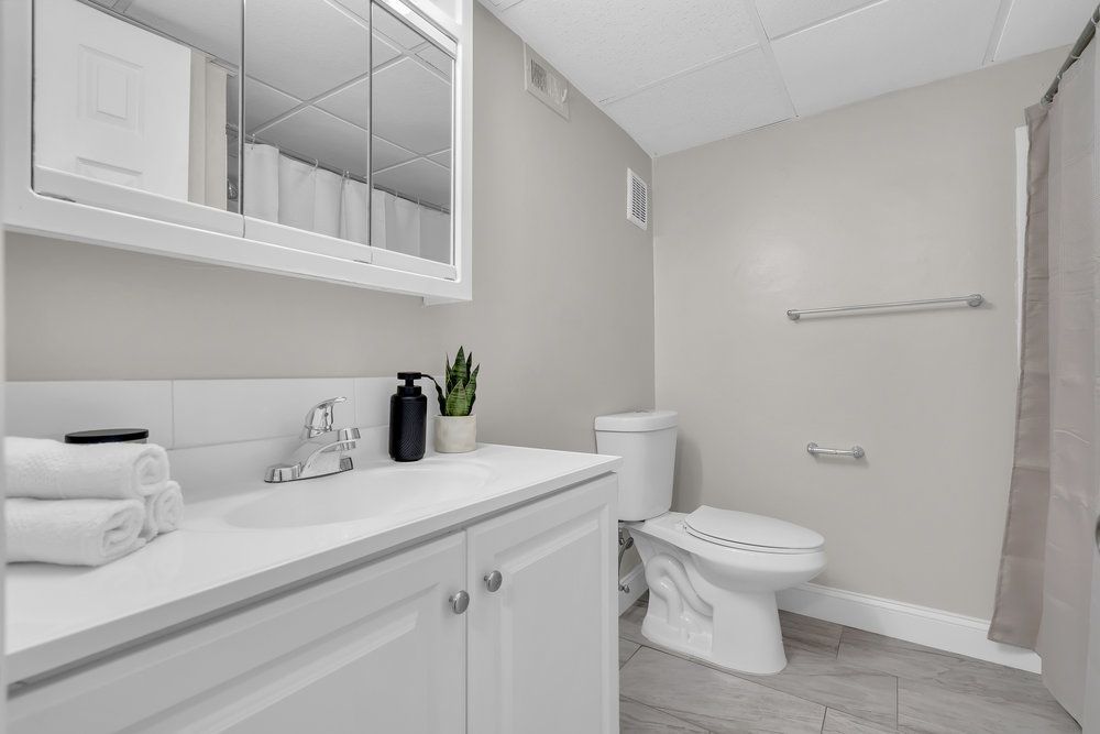 Bathroom with vanity and shower at Town Bank Manor