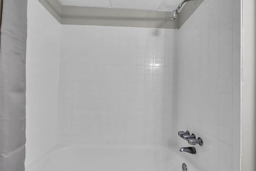 Bathroom with vanity and shower at Town Bank Manor