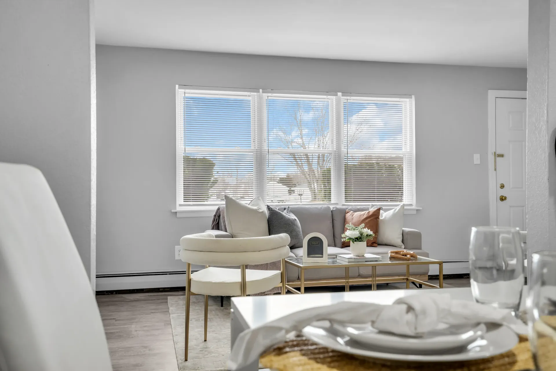 Modern living room with large windows at Town Bank Manor Apartments, NJ