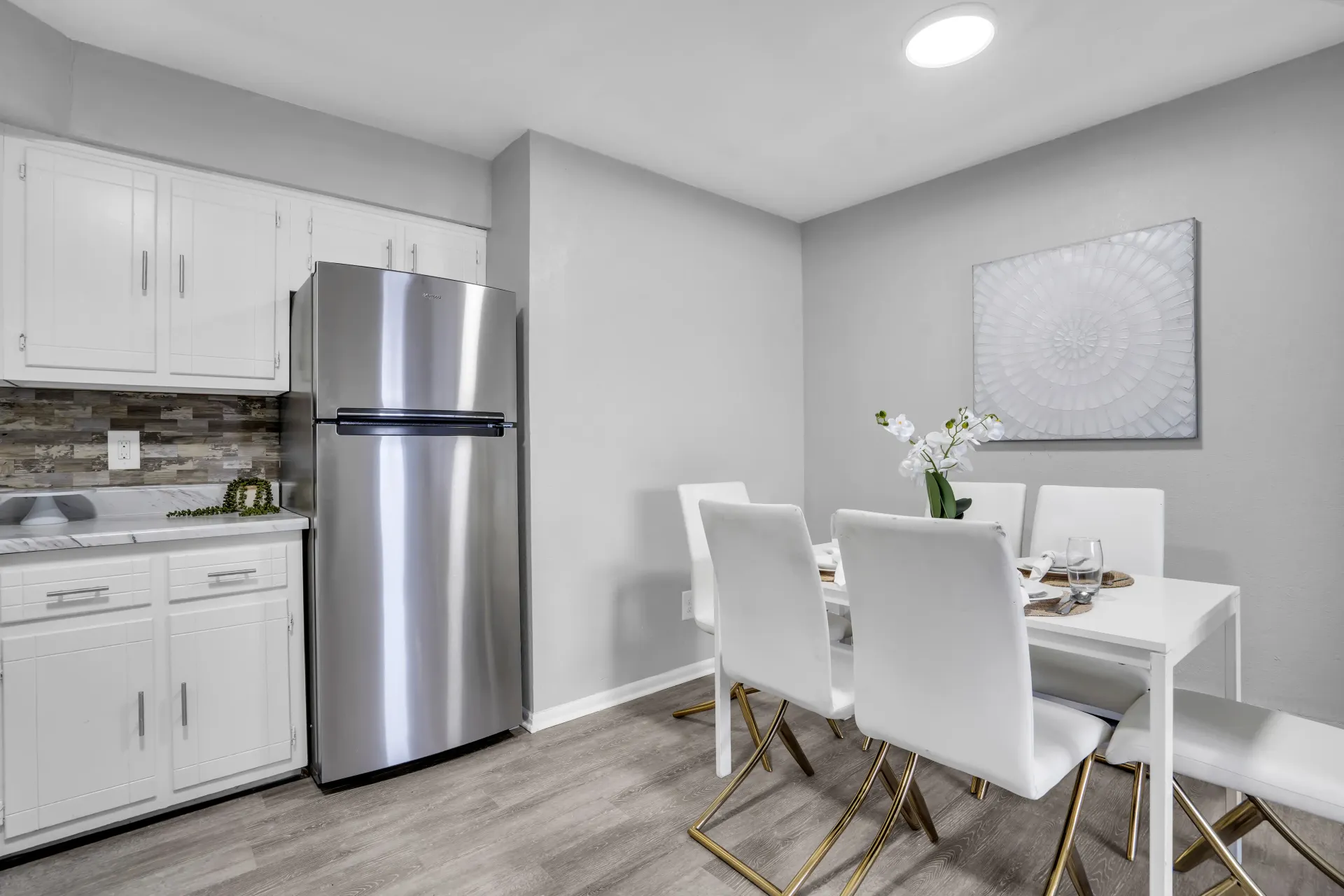 Eat-in kitchen with stainless steel refrigerator at Town Bank Manor Apartments, NJ