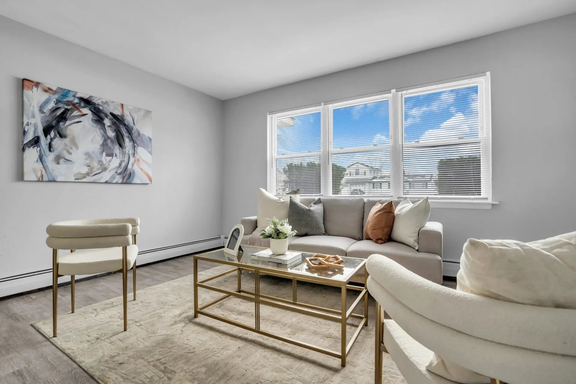Furnished living room with large windows at Town Bank Manor Apartments in Town Bank, NJ