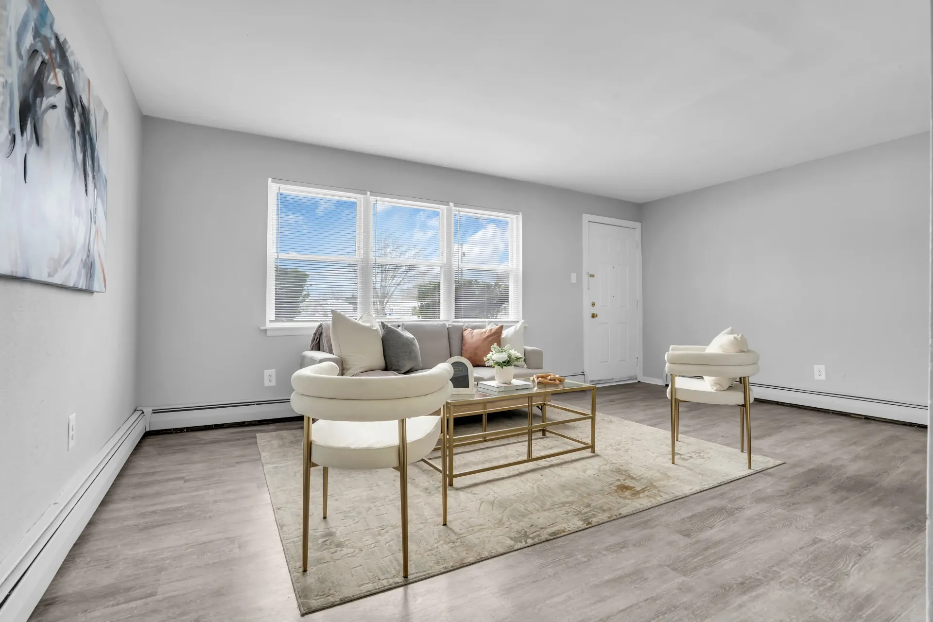 Sunlit living room with comfortable seating at Town Bank Manor Apartments in NJ