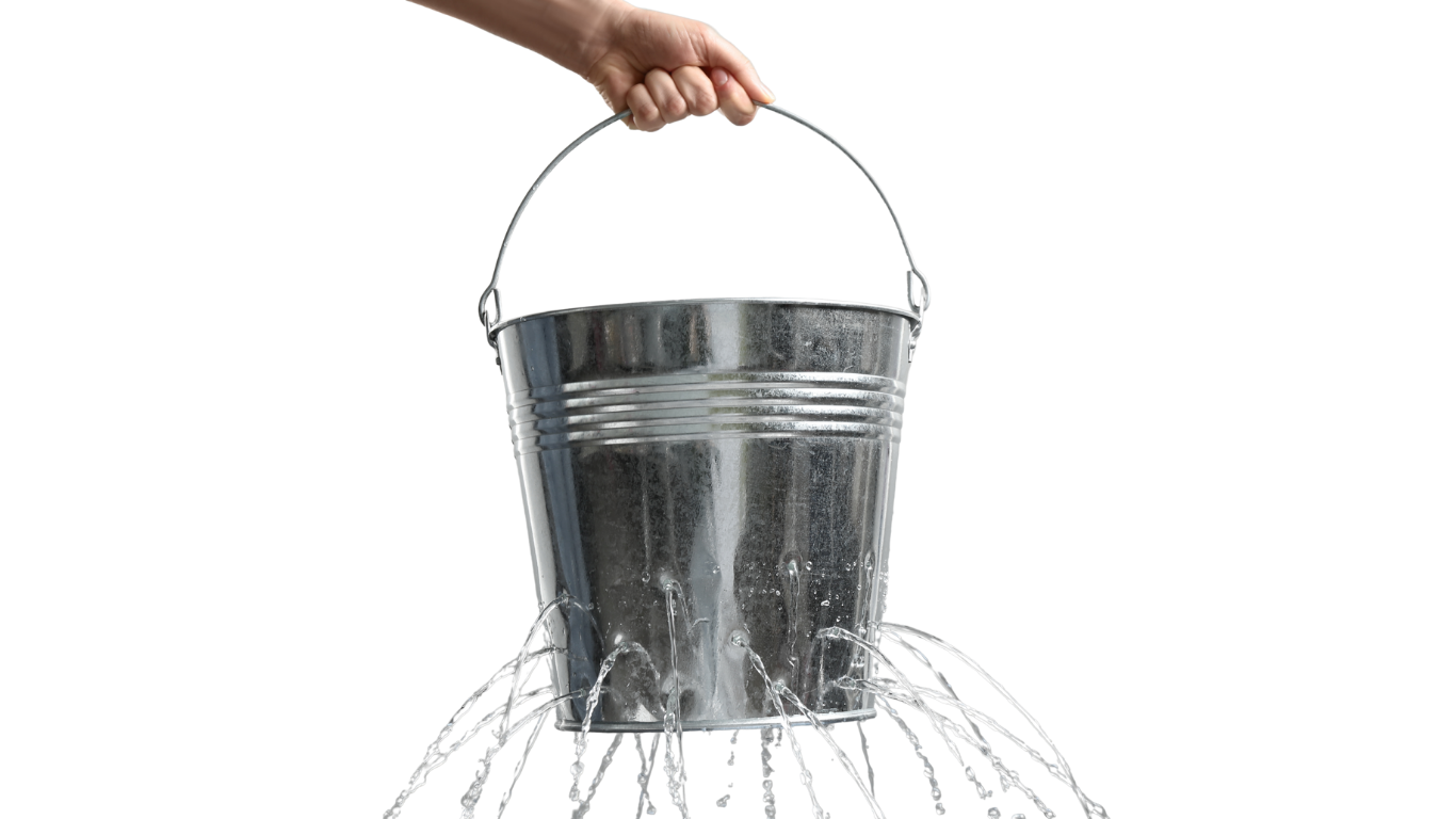 a metal bucket is held by the handle and has water pouring out of many holes on the bottom