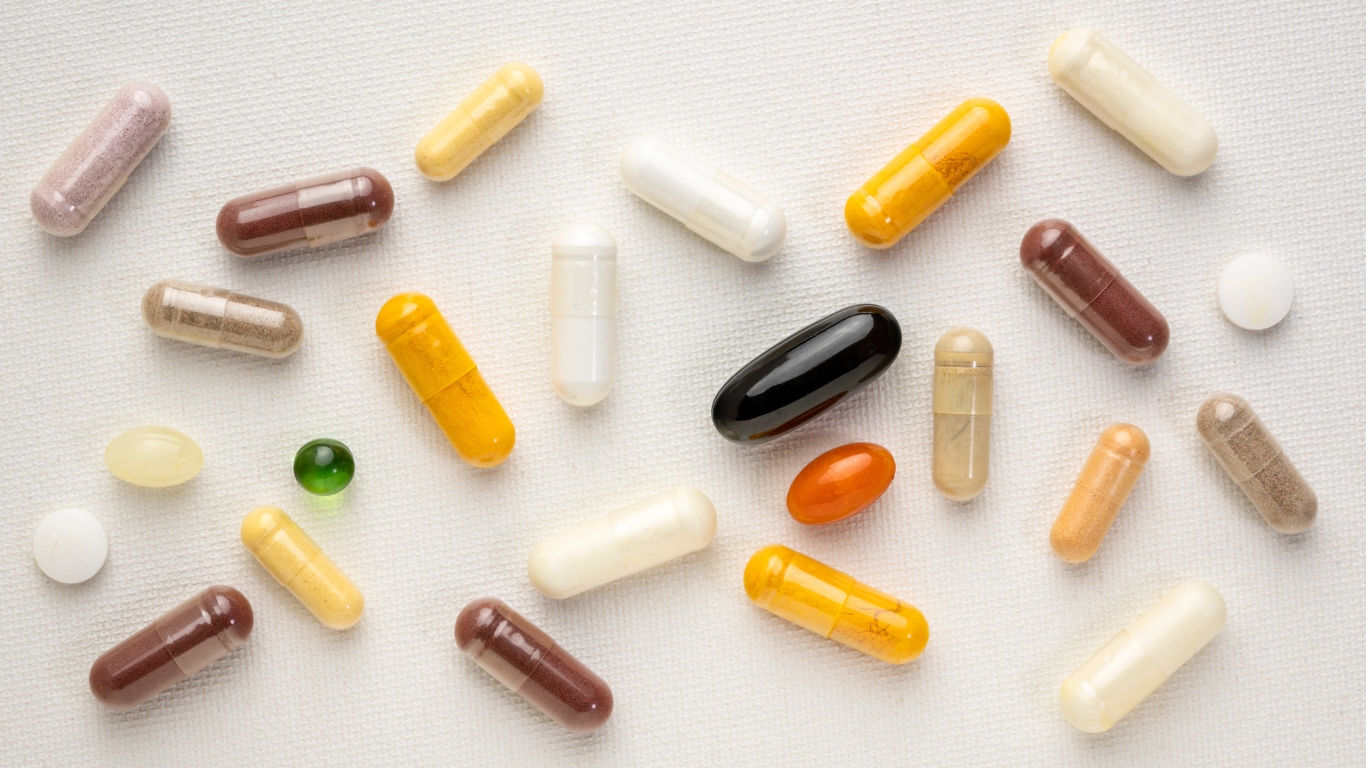 Various wellness supplements arranged on a clean white surface.