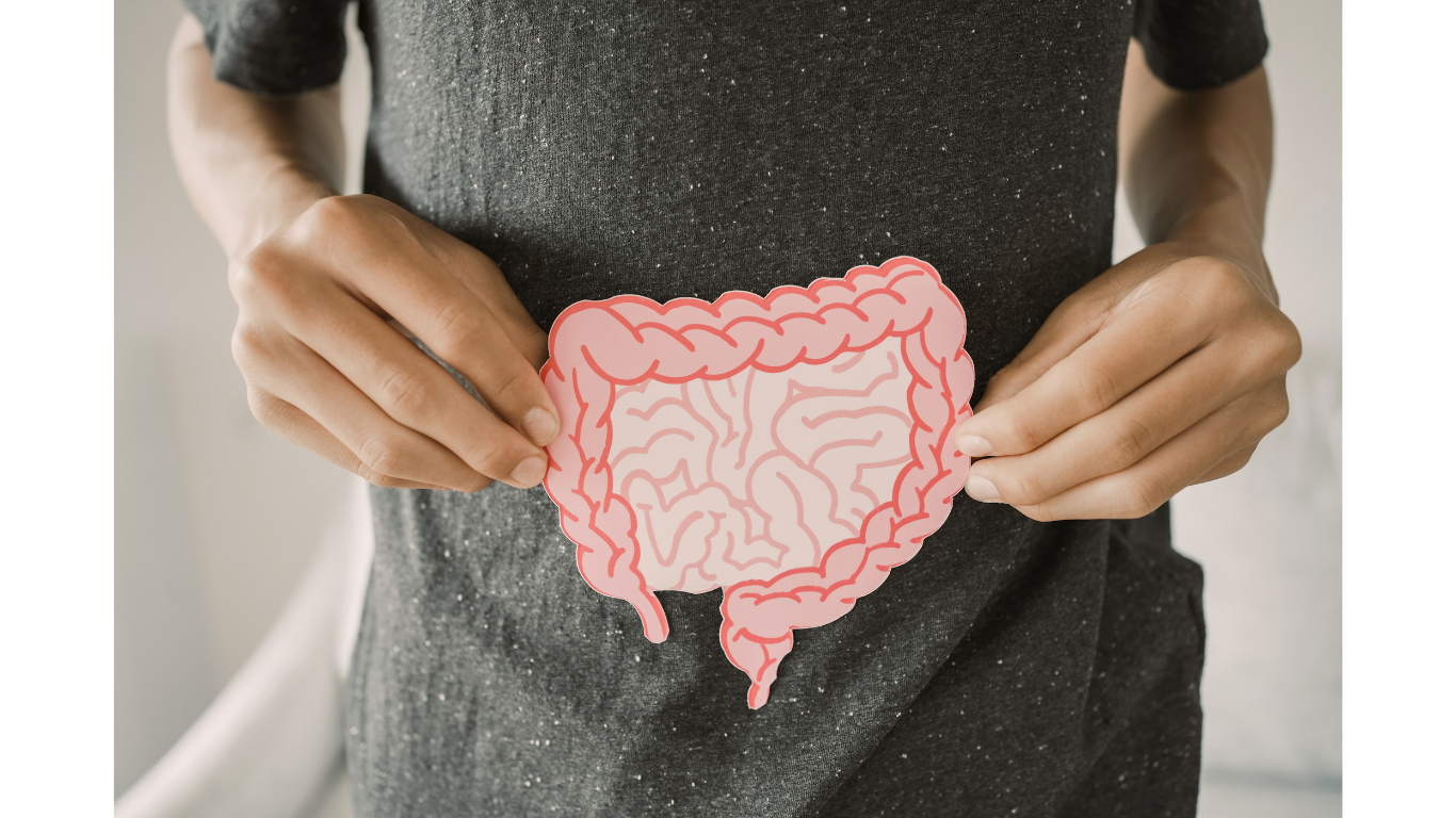 An overhead spread of people eating vibrant, healthy foods on a table with drinks