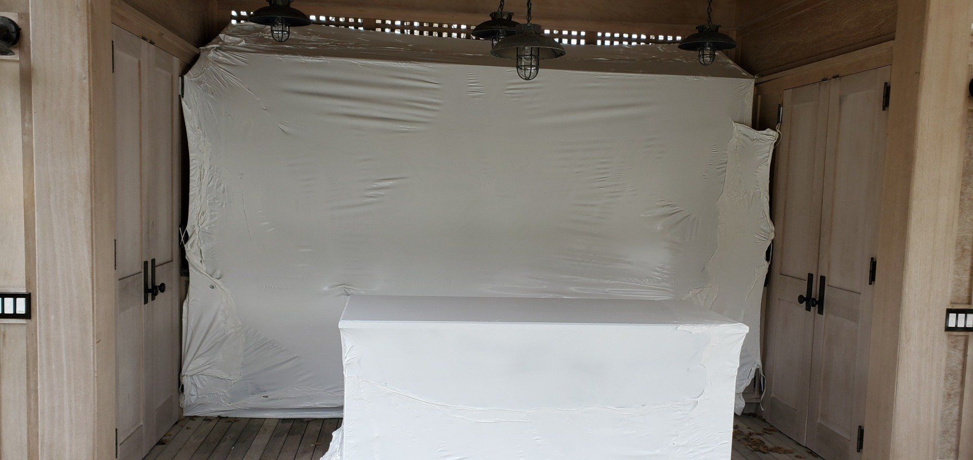 a large white box wrapped in white shrink wrap .