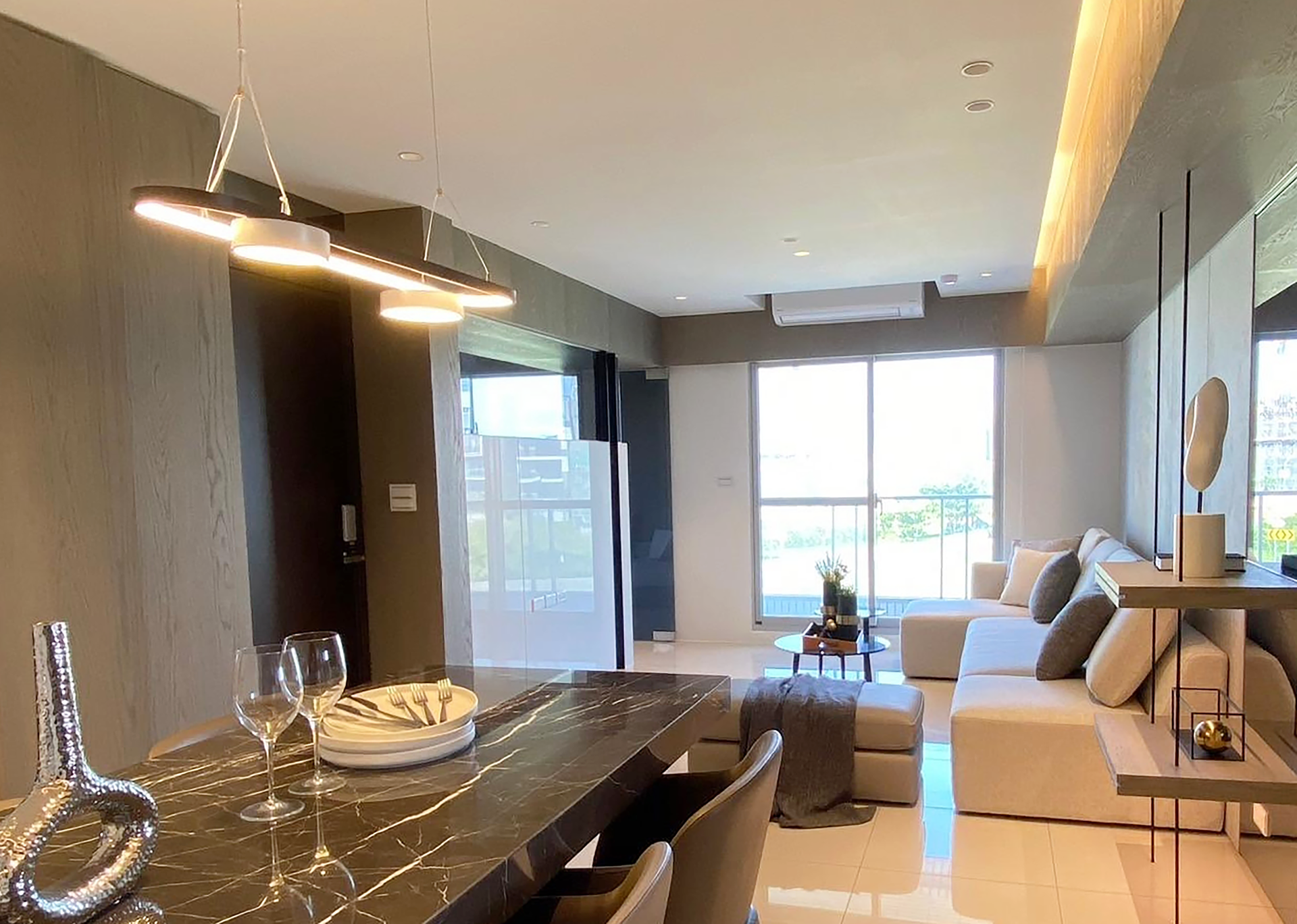 A living room with a dining table and a couch.