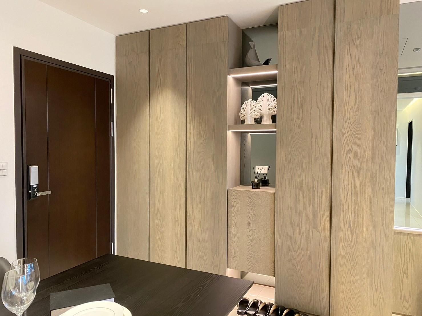 A dining room with a table and a glass of wine.