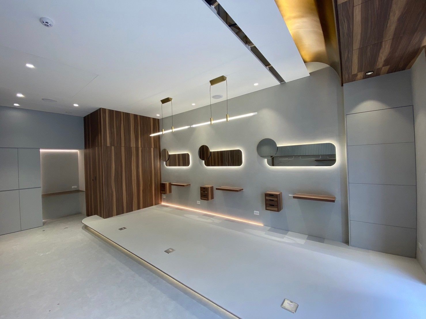 An empty room with a wooden wall and a ceiling.