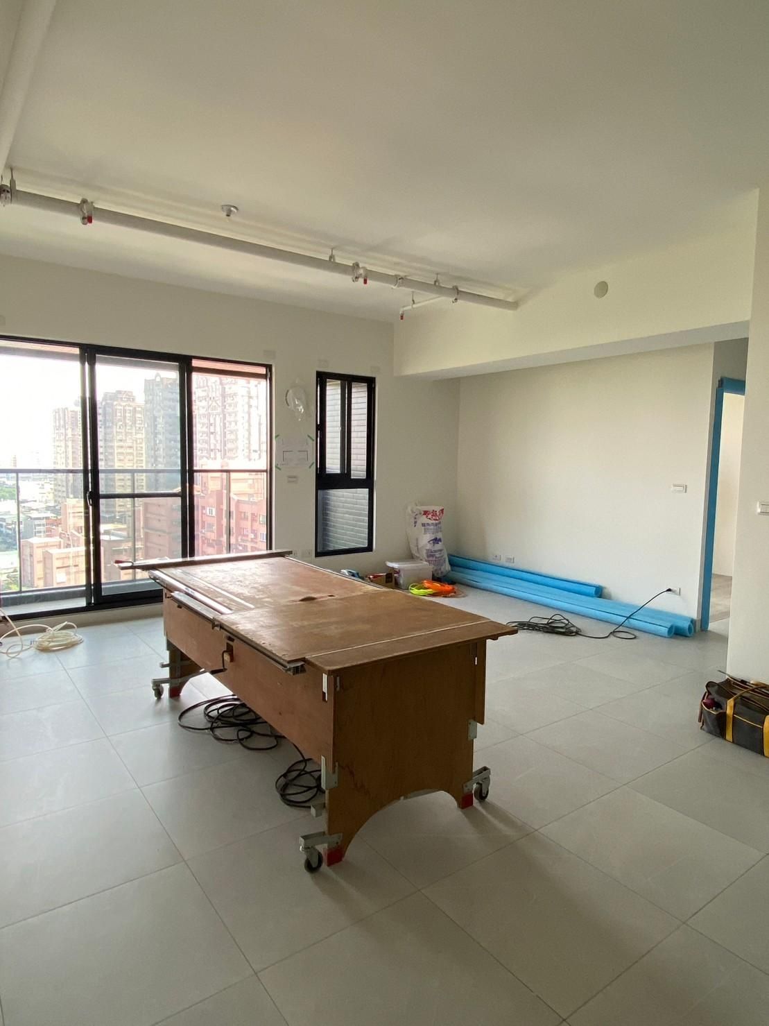 There is a table in the middle of the room.