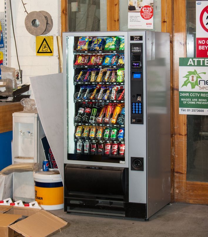 a vending machine with a sign that says atte on it