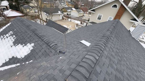 An aerial view of a roof with snow on it.