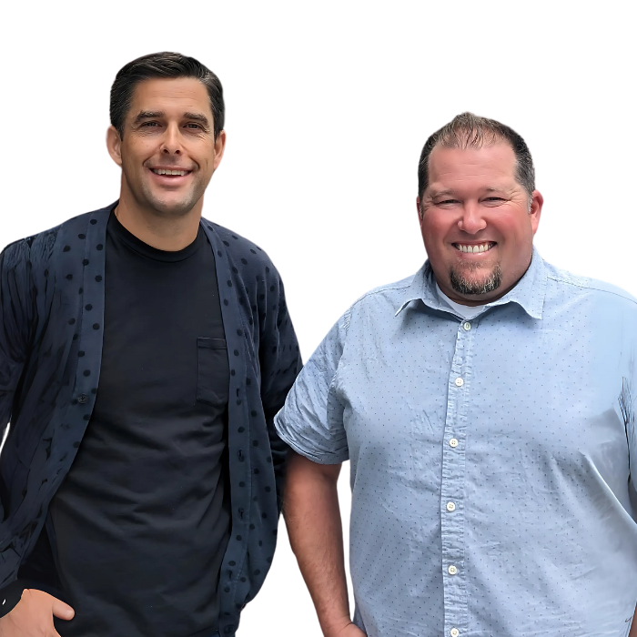 Two men are standing next to each other and smiling for the camera