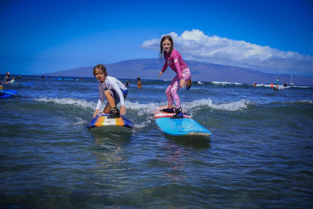 Girl and Boy Surfing