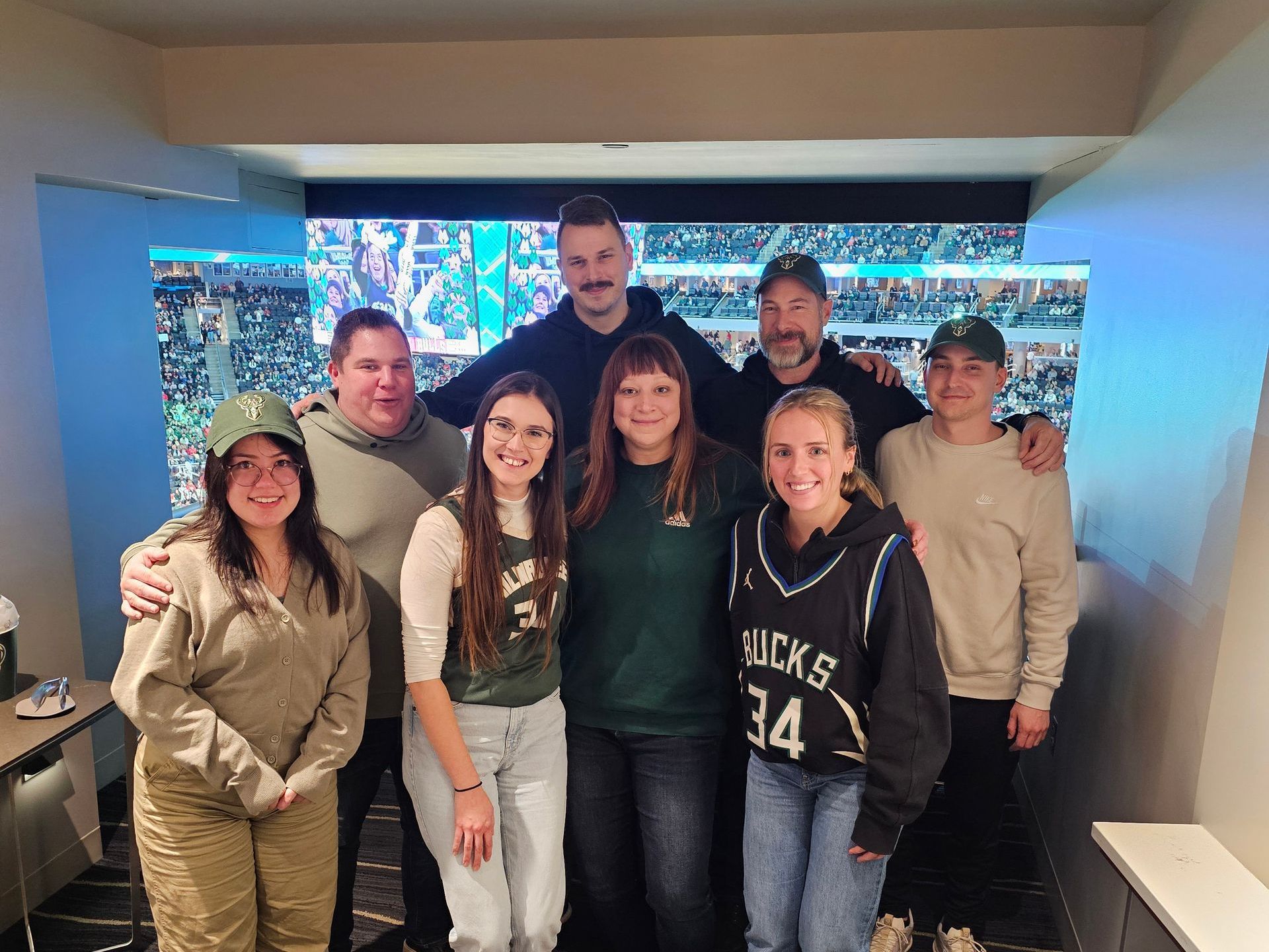 A group of people are posing for a picture together.