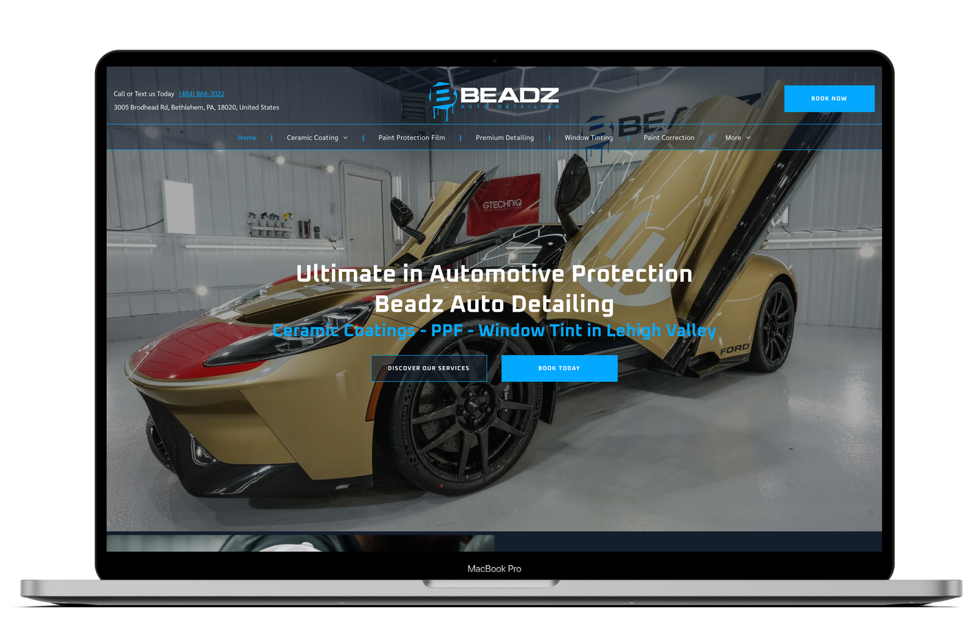 a laptop with a picture of a car on the screen .