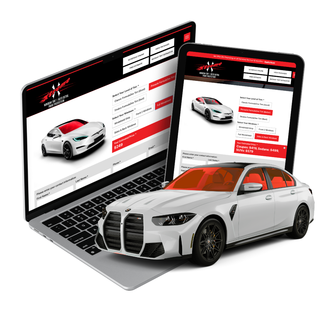 A white car is sitting on top of a laptop and tablet.