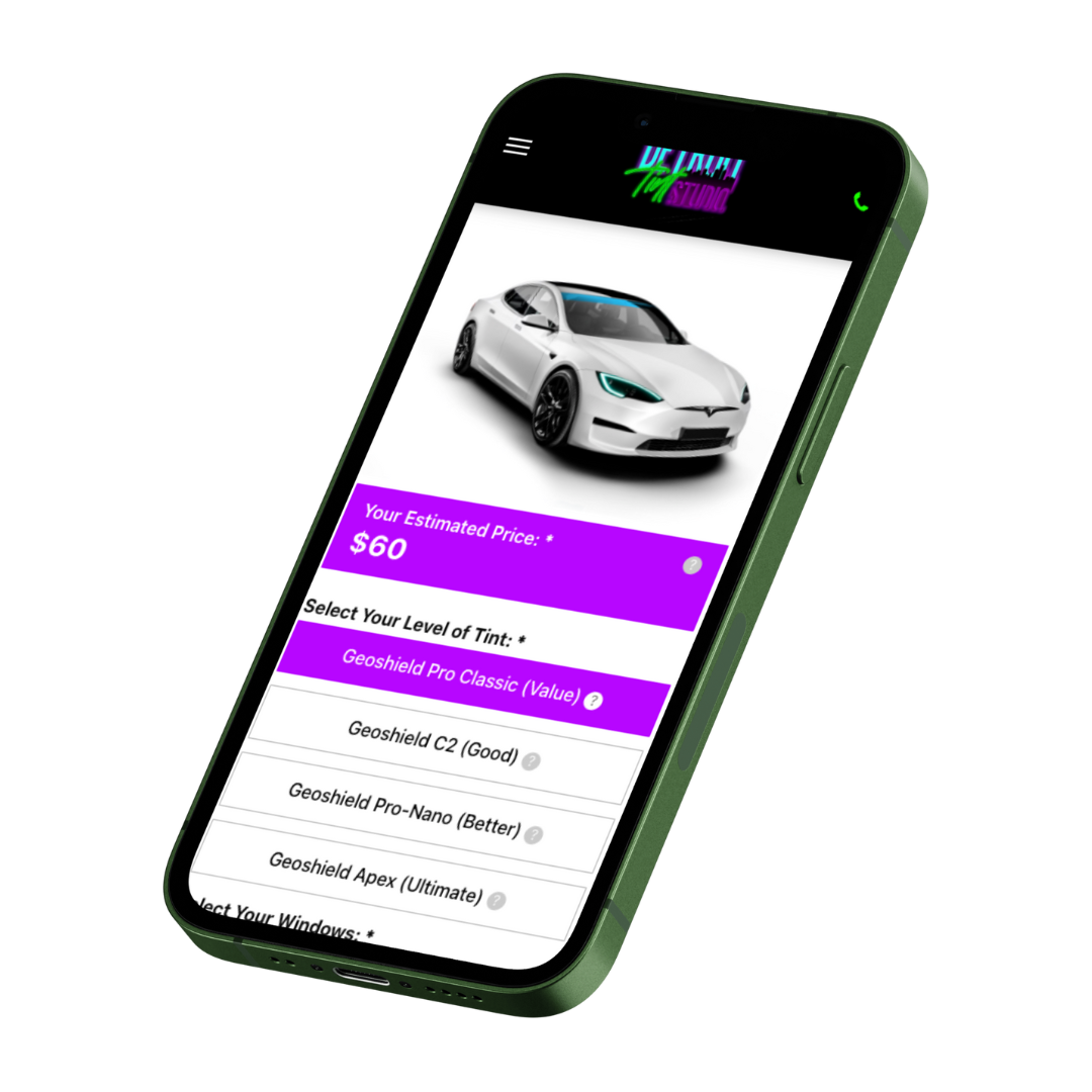 A cell phone with a picture of a white car on the screen.