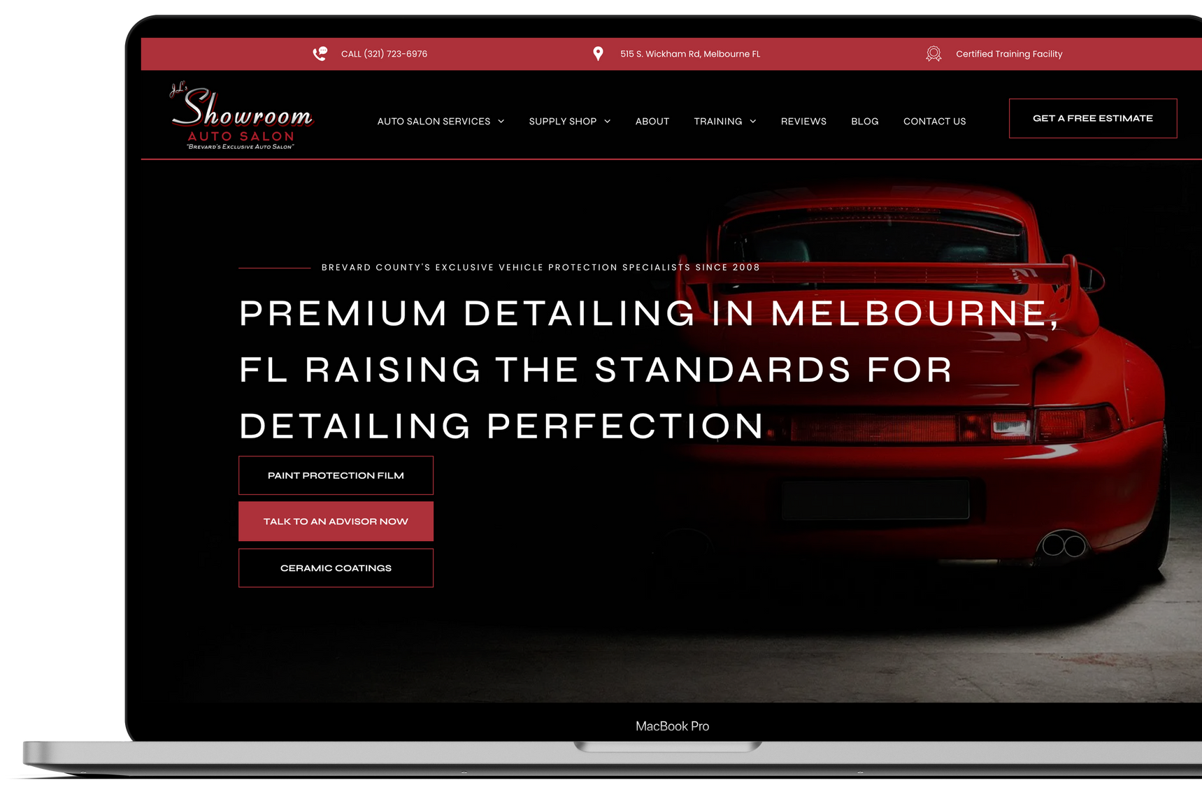 a laptop with a red car on the screen .