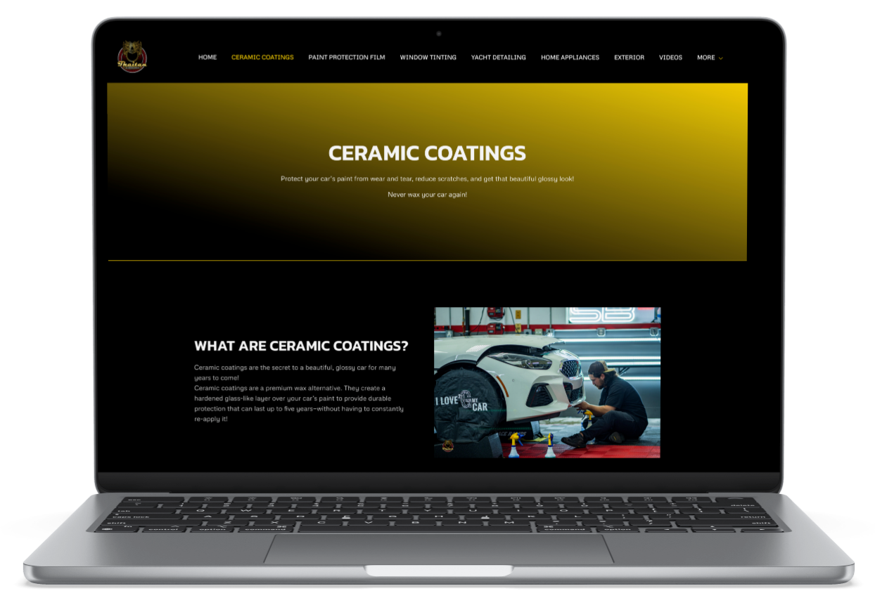 A laptop computer is open to a website for a window tinting company.