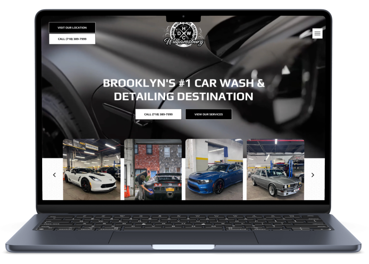 A laptop computer is open to a car wash and detailing website.