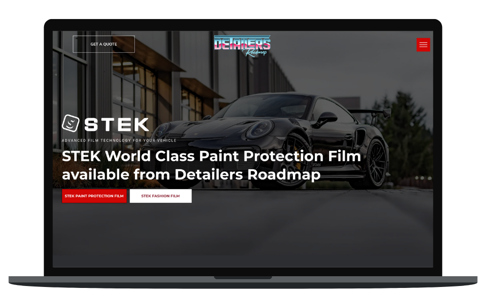 A laptop with a picture of a car on the screen.