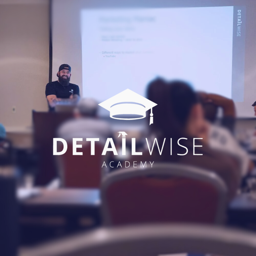 A man is giving a presentation at the detailwise academy